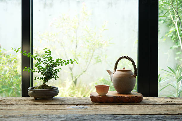 istock old teapot and earthenware tea cup and plant pot with home gardening view 2215263382