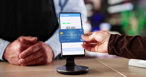 istock Woman Making Contactless Credit Card Payment 2215268456