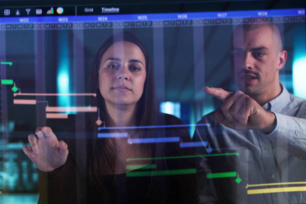 istock Virtual Project Manager Organizing Schedules And Charts 2215268501