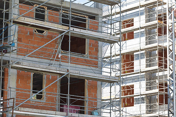 istock Construction site with scaffolding and exposed brick walls during building process 2215271717