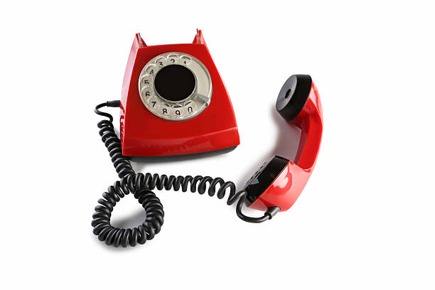 istock Red retro telephone isolated on a white 2215272511