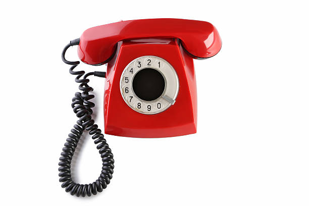istock Red retro telephone isolated on a white 2215273449