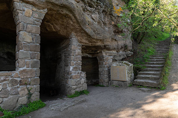 istock Tihany cave monastery ruins with stone columns and forest path 2215274856