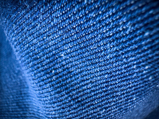 close-up of a piece of blue fabric. Textured background in macro photography