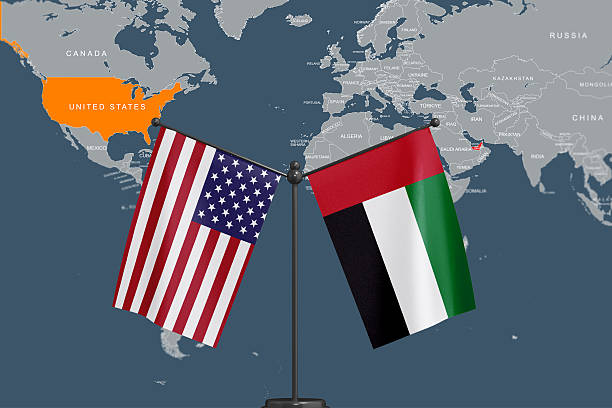 istock United States and UAE Flags with World Map Background 2215277546