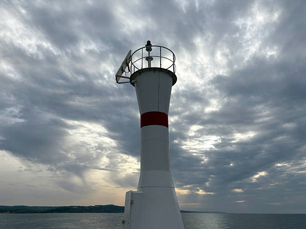 istock Lighthouse on the sea with dramatic sky 2215278407
