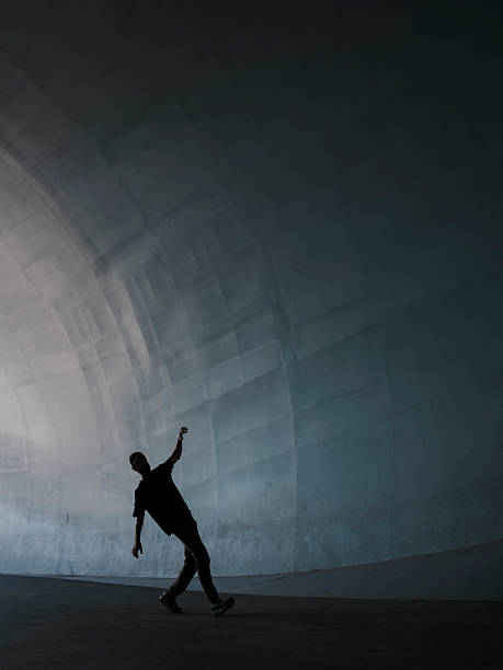 sport running activity person silhouette unrecognizable in ghetto back street underground path way frame work advertising concept pattern empty copy space for text