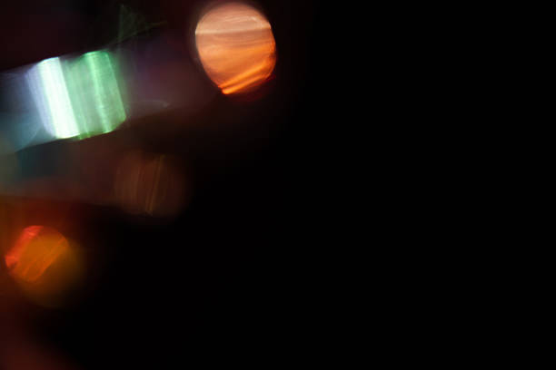 Blur colorful rainbow crystal light leaks on black background. Defocused abstract multicolored retro film lens flare bokeh analog photo overlay or screen filter effect. Glow Vintage prism colors