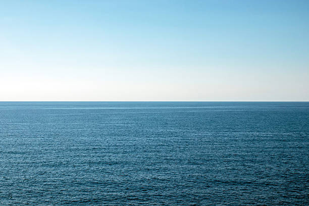 istock The ocean is calm and clear, with no visible waves or ripples 2215281802