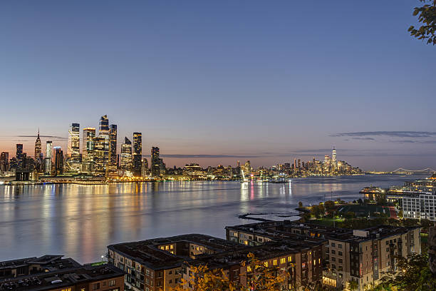 The skyline of Manhattan, New York City, and the Hudson River at twilight
