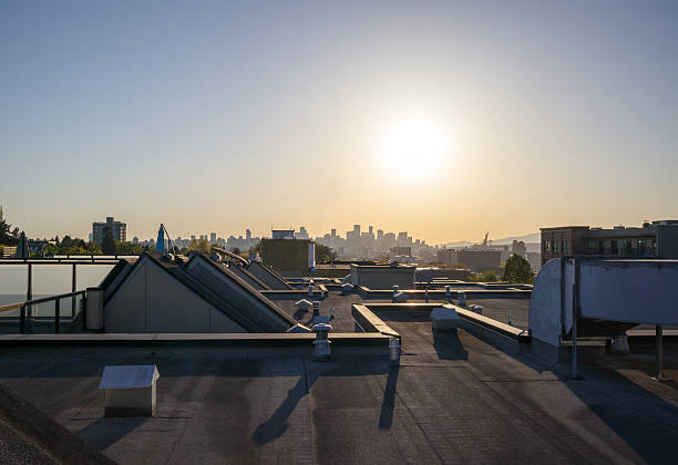istock Flat roof with city skyline during sunset. 2215285538
