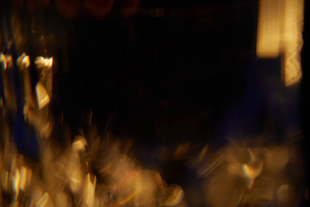 istock Abstract light leaks on black background with copy space. Studio lens flare bokeh effect. 2215286704