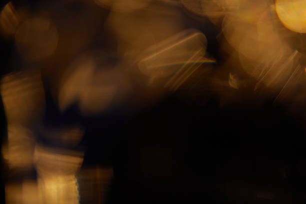 istock Abstract light leaks on black background with copy space. Studio lens flare bokeh effect. 2215286711