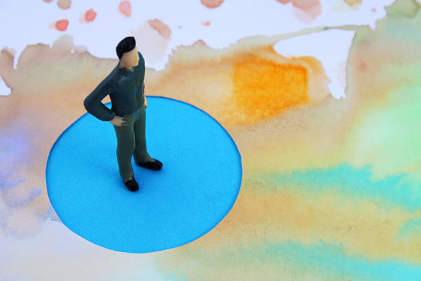 istock Executive over comfort zone surrounded by an insecure and abstract background of colorful spots 2215286776
