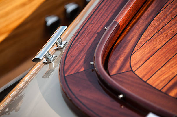 istock polished wooden boat deck with chrome cleat.. 2215288437