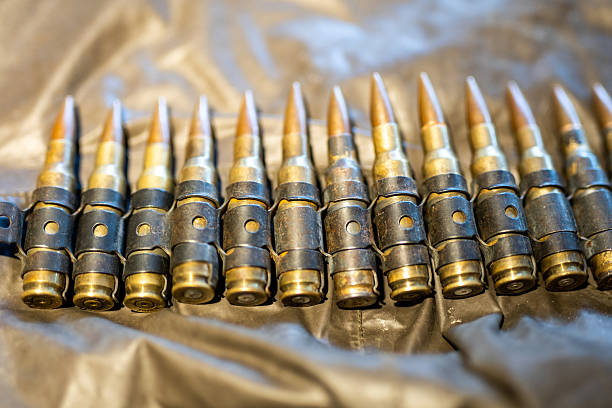 istock Machine gun bullets in cartridge 2215290363