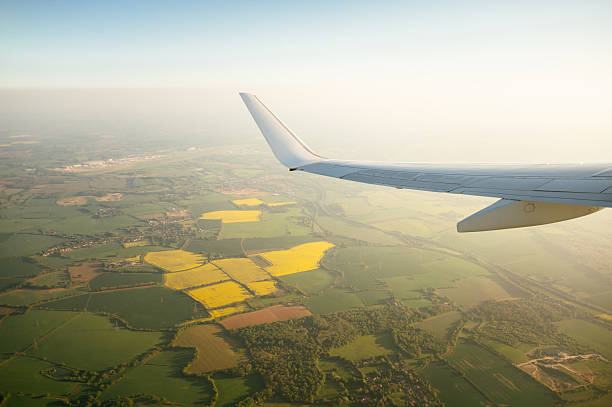 istock Airplane flying over the countryside 2215296746
