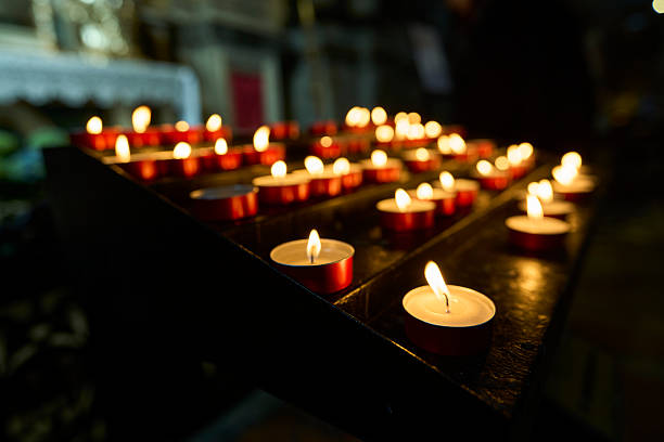 Lit candles in a church creating a serene atmosphere.