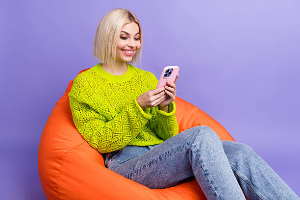 istock Photo of sweet cute lady wear green pullover communicating modern device empty space isolated purple color background 2215317463