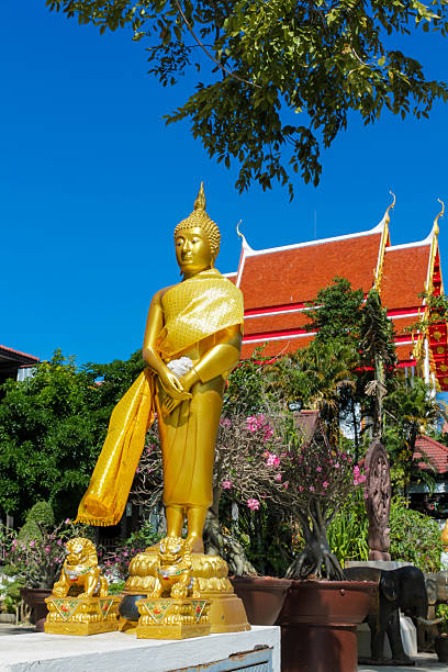 istock Buddha gold statue in a Buddhist temple Wat in Thailand 2215317930