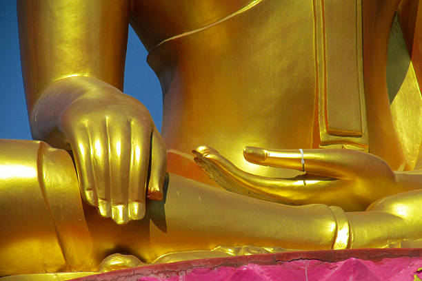 istock Buddha gold statue in a Buddhist temple Wat in Thailand 2215318233