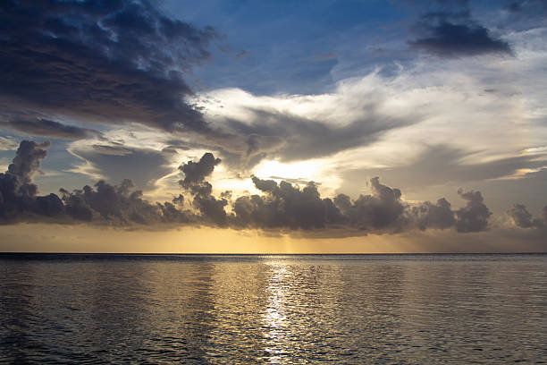 istock Sunset Over the Sea with Clouds in the Sky 2215318625