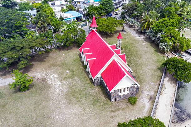 Notre Dame Auxiliatrice Church with distinctive red roof at Cap Malheureux, Mauritius, Indian Ocean