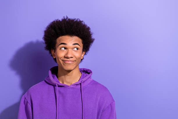 istock Portrait of satisfied minded creative man look interested empty space brainstorming isolated on purple color background 2215324983