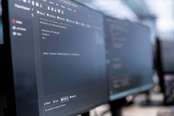 istock Close up of computers in data center running server rigs diagnostic tests 2215328356