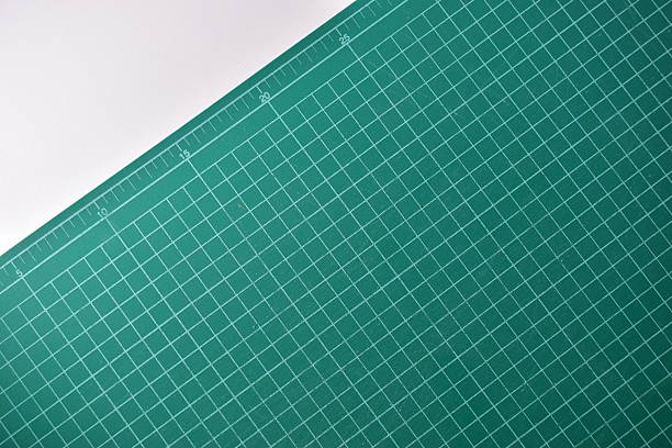 istock green cutting mat board on white background with line and scale measure guide pattern for object art design, tool equipment of diy craft work 2215328371
