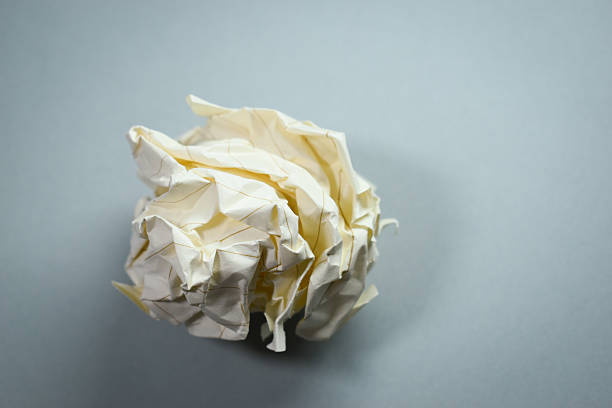 round lump paper on grey background, recycle used paper