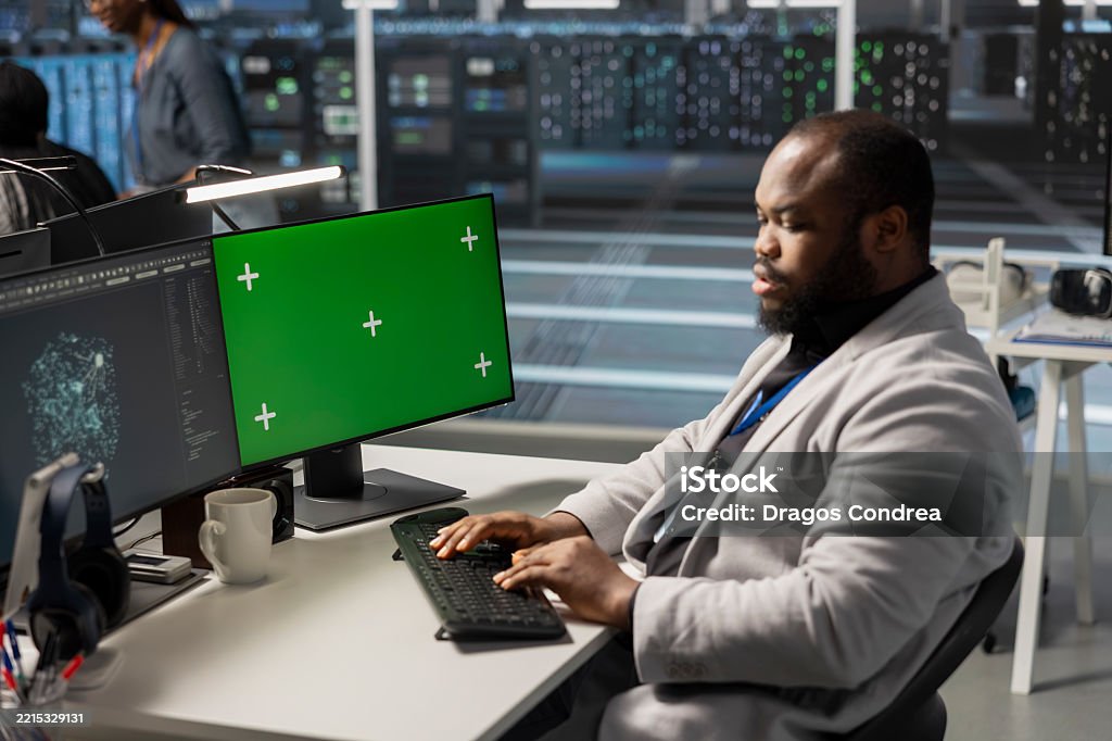 Data Center Engineer Analyzing Software Logs Metrics On Green Screen ...