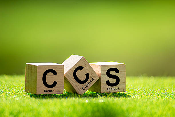 istock Symbol CCS  for Carbon Capture Storage words CCS on a wood cube on the environmental background. Net zero action concept. green energy, reduce carbon footprint, Save energy, carbon dioxide. 2215332214