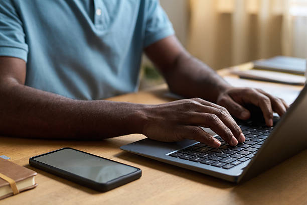 istock Male Hands Texting on Laptop 2215332860
