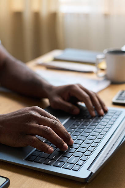 istock Hands Of Unrecognizable Man Typing on Laptop at Work 2215332876
