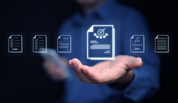 istock Document Management System concept. A man with his smartphone searches for a file stored in the DMS system for store, share, track and manage files or documents. 2215332908