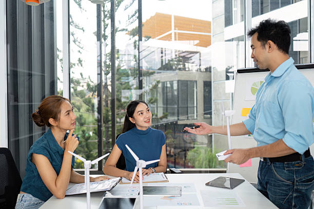 istock Sustainability and ESG. Engaged team brainstorming in a bright office environment. 2215336565