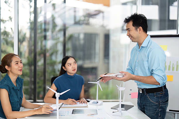 istock Sustainability and ESG. Professionals engaging in renewable energy project planning. 2215336633