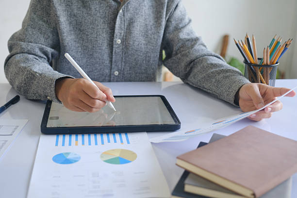istock Professional businessman analyzing financial graphs investment marketing data. 2215337109
