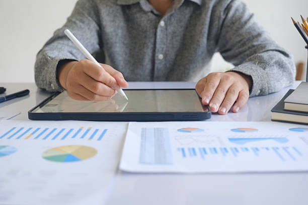 istock Professional businessman analyzing financial graphs investment marketing data. 2215337110