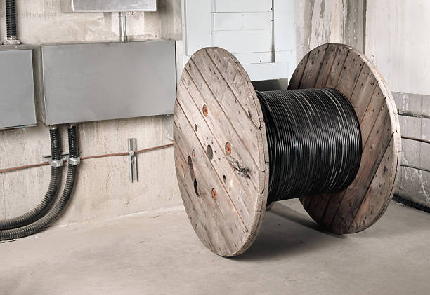 istock Fiber optic wooden cable reel in electrical room. 2215339202