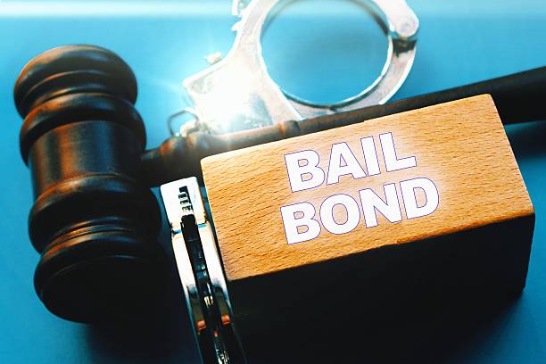 istock Judge gavel, handcuffs - Bail bonds services concept. 2215339812