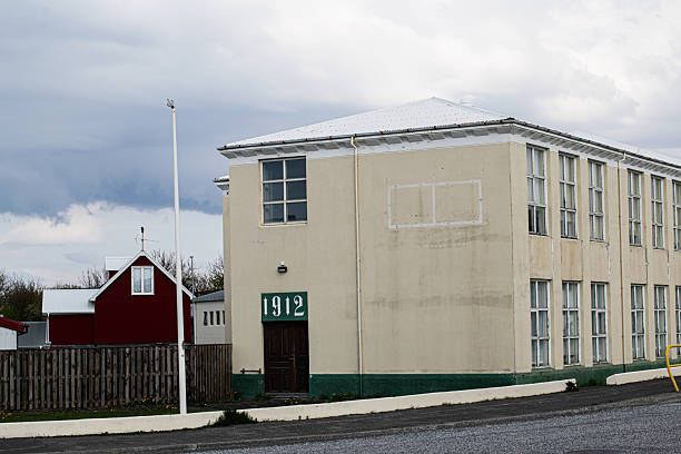 Colorful houses and rooftops in Reykjavík, Iceland, are shown in a scenic urban view.