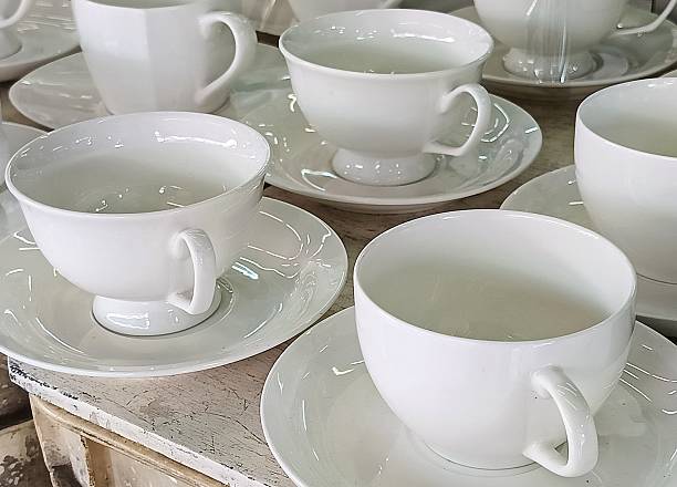 istock Elegant White Porcelain Teacups and Saucers. 2215345712