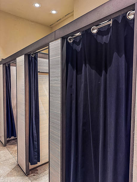 istock Dressing room with black curtains and modern design elements for retail shopping experience 2215348684