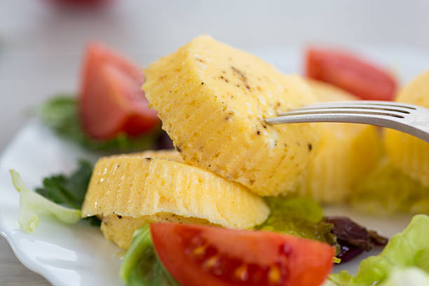 Lush egg omelette with lettuce and tomatoes on a plate.