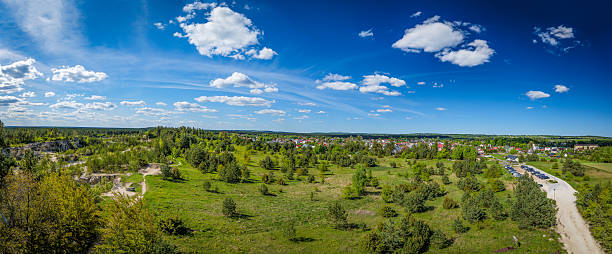 istock Panorama. Landscape. View from the observation tower. Beautiful blue sky with a few clouds. Quarry, forests. Jozefow, Lublin Voivodeship, Roztocze region, Poland. Spring. 2215351264