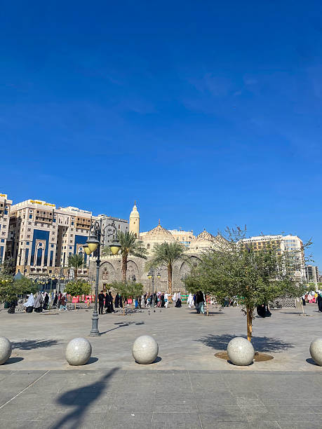 istock Peaceful public square in Madina with people, lights, and architecture. 2215356122