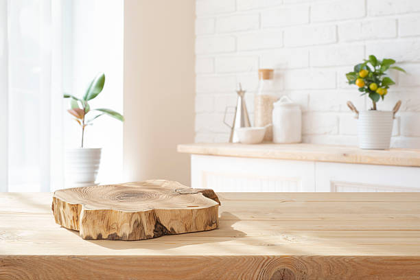 istock Unique podium board on wooden kitchen countertop against blurred interior background 2215356894