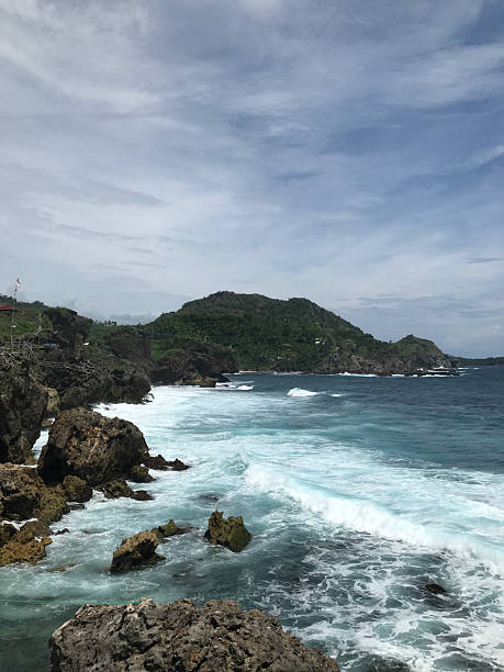 istock Rocky Coastal Landscape with Ocean and Lush Hills 2215358708